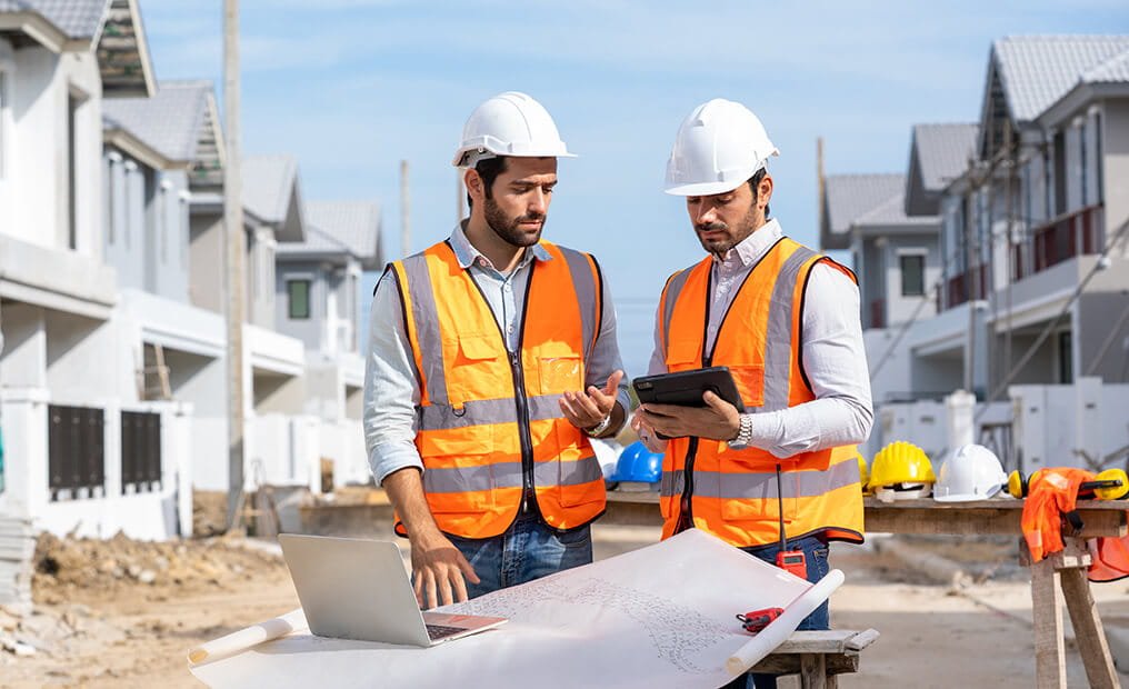Construction team reviewing plans on site